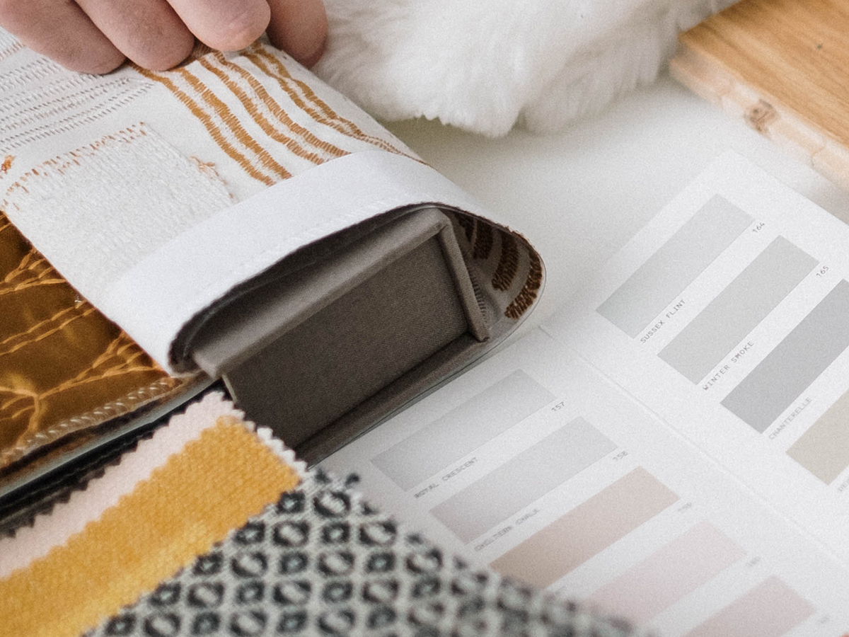 Close up of interior design colours and fabric swatches under Reside Living Interiors
